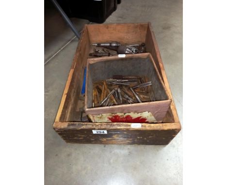 A box of machine tools including taps, etc.