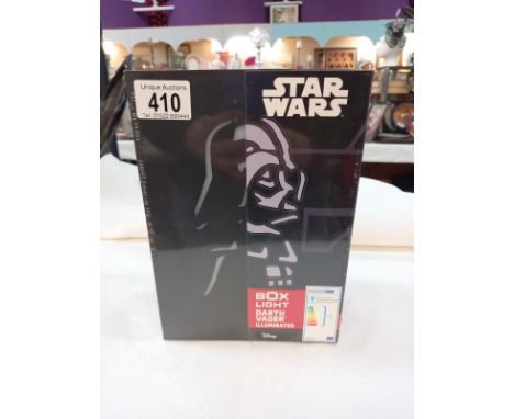 A Star Wars Darth Vader box light. (Sealed and new).
