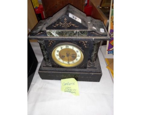 A black slate mantle clock with pendulum, no key, springs ok
