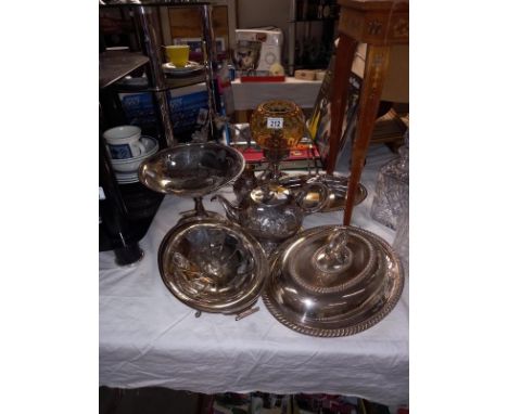 A good selection of silver plate including tureen, bottle stand and candle lamp with amber glass stand