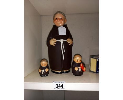 A Goebel monk decanter and 2 salt pots.