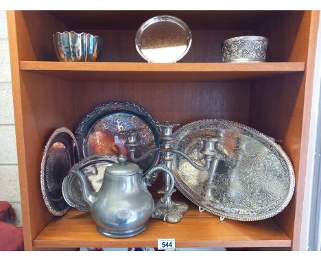 A quantity of silver plate and pewter including candelabra, trays etc. 2 shelves.