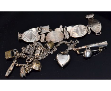 A 20th Century hallmarked silver link bracelet formed of five oval links with alternating engine turned sunburst and geometri