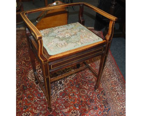 An Edwardian line inlaid mahogany music stool with tapestry padded seat, width 50cm
