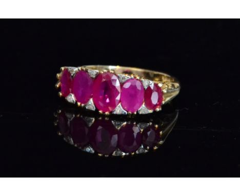 A 9ct hallmarked Victorian style ruby and diamond ring set with five graduated rubies spaced by five pairs of diamonds, ring 
