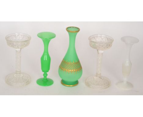 A 19th Century alabaster glass vase of footed ovoid form with drawn collar neck, decorated with a gilded band over the opaque