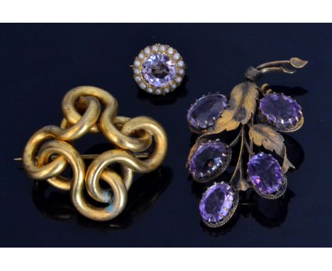 A 19th Century gold open knot brooch of plain form, possibly 15ct, together with an amethyst set floral spray and a circular 