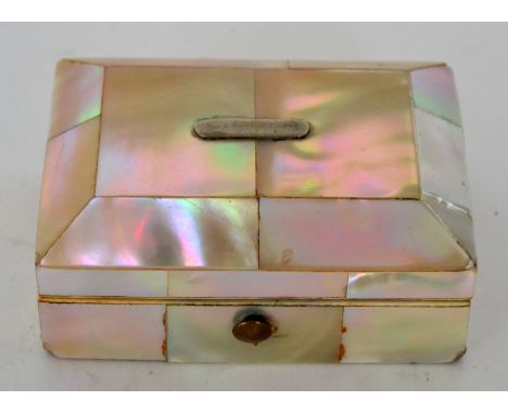 A small mother of pearl box of rectangular form, containing three sewing items including a tape measure, width 6.5cm, S/D.