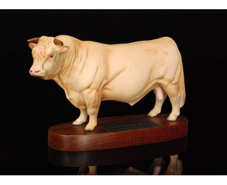 A Beswick Connoisseur Charolais Bull model A2600 raised to a wooden oval plinth