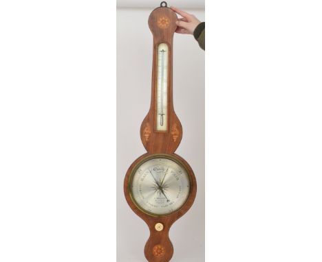 A George III inlaid mahogany wheel barometer decorated with shell paterae silvered dial by F Molton Dove Lane Norwich, incorp