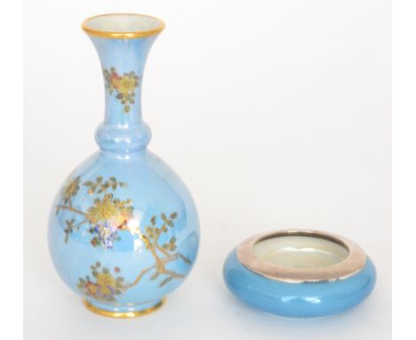 A Wiltshaw and Robinson Carlton Ware bud vase of globe and shaft form decorated with blossom against a blue lustre ground, pr