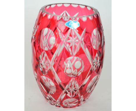 A post-war Royal Brierley crystal glass vase of barrel form cased in ruby over clear crystal with a repeat diamond and printi