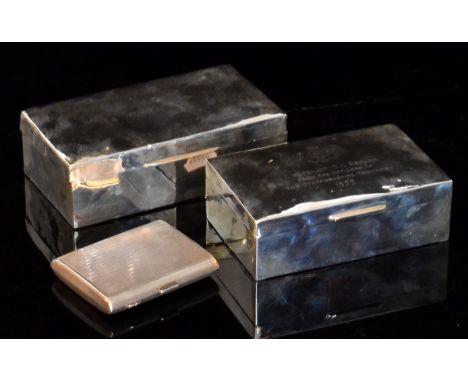Two hallmarked silver cigarette boxes, each of plain rectangular form, one monogrammed, the other from the Queen's Own Royal 