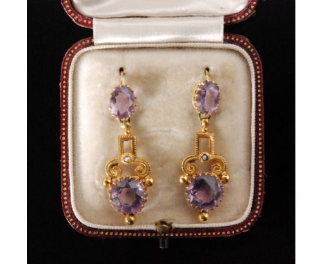 A pair of Victorian gold, amethyst and seed pearl drop earrings, each with circular cut amethyst drop and scrolled seed pearl