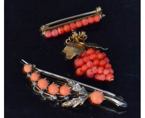 A 19th Century coral pin brooch, the circular coral beads wound on yellow metal wire to form a bunch of grapes, with golden v