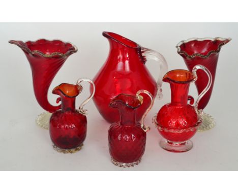 A pair of post-war Italian Murano glass vases in the form of cornucopia in ruby crystal with gold aventurine and applied clea
