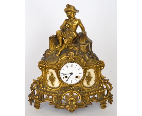 A 19th Century gilt metal mantle clock by Henry Marc Paris, eight day striking movement below a seated cavalier figure wearin