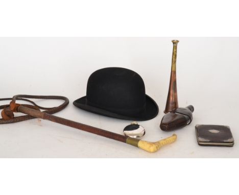 A riding crop, a copper hunting horn, two hip flasks, a silver mounted leather wallet and a bowler hat by Dunn & Co (6)