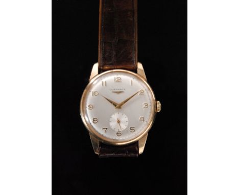 A mid 20th Century Longines 9ct gold gentleman's manual wind wristwatch, the circular white satin dial with gilt Arabic numer