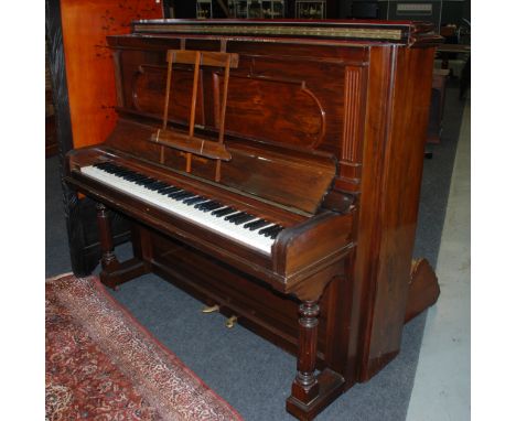 An early 20th Century Steinway and Sons rosewood cased upright overstrung piano No 109532 on shaped sides and turned front le