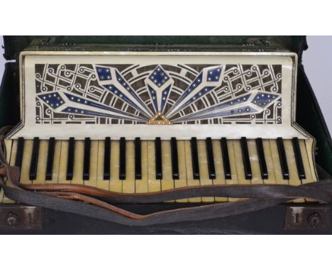 A Petro accordion, cased.