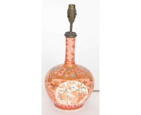 A late 19th to early 20th Century Japanese export vase of globe and shaft form decorated with cartouche panels, one depicting