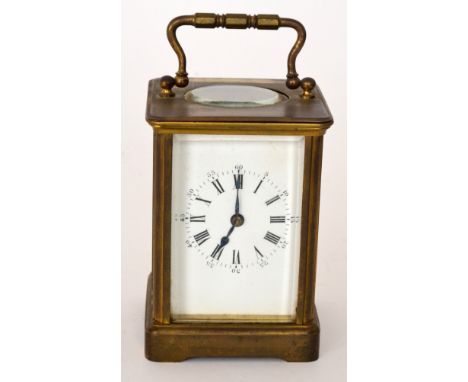 A late 19th Century brass carriage clock, white painted enamelled dial, striking movement, height 11cm