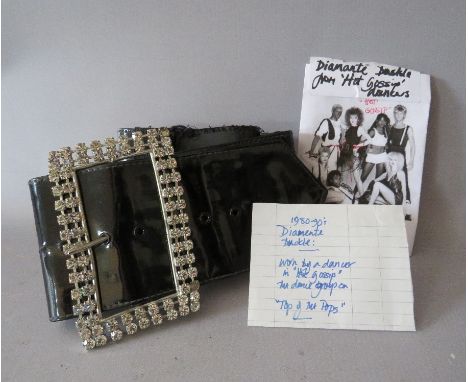 A VINTAGE PATENT BELT WITH DIAMANTE BUCKLE, from a member of Tot Of The Pops 'Hot Gossip' dance group, circa 1980/90