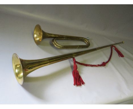 A BRASS HERALDIC TRUMPET TOGETHER WITH A MILITARY LONG BUGLE BY HENRY POTTER, ALDERSHOT (2)