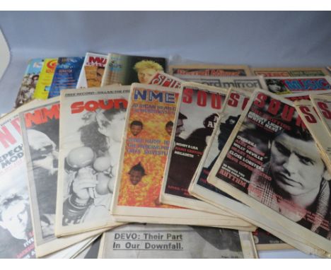 A COLLECTION OF VINTAGE NME NEWSPAPERS, together with a selection of other music papers and cuttings to include Sounds and Th