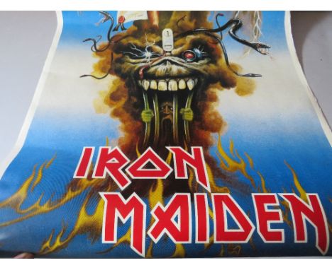 A VINTAGE IRON MAIDEN 'THE EVIL THAT MEN DO' POSTER, together with a selection of posters comprising ELO, Bob Dylan and The K