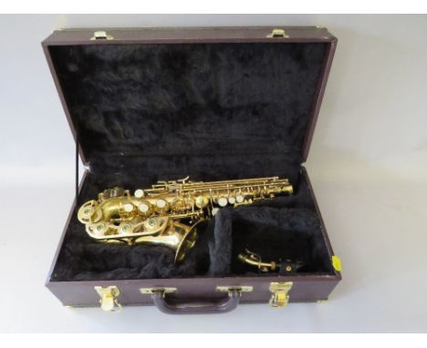 A KOHLERT STUDENT MODEL ALTO SAX WITH FITTED CASE, having a lacquered brass body  and mother of pearl style key pads, with tw