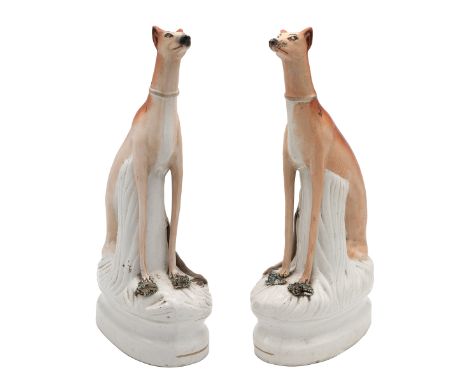 'High and Mighty' - pair of 19th Century Staffordshire flatbacks of hunting dogs with hares. H 32cm.