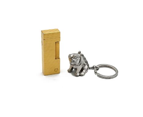 Sterling silver Dunhill bulldog key fob, 74g, and a gold plated Dunhill lighter. (2)