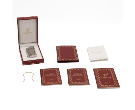 Must de Cartier lighter. Ribbed chrome, Serial No. 209537, branded red case, guarantee wallet and white card outer box. Light