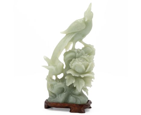 Vintage Chinese carved jade depicting two birds on a flower, on a wooden stand. Overall height 24.5cm.