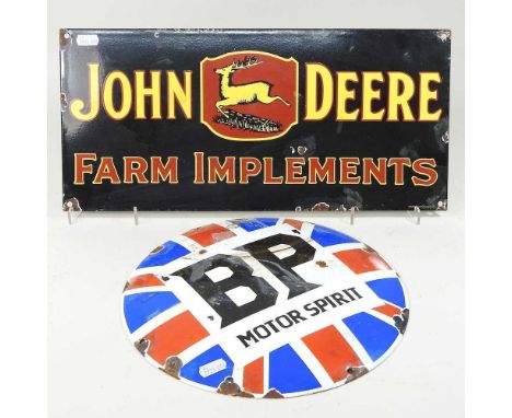 A black painted metal advertising sign, 45cm, together with a circular BP sign (2)