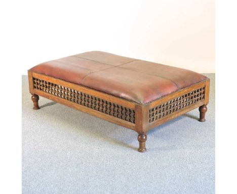 A large Eastern style leather upholstered stool, on turned legs35w x 85d x 47h cmOverall complete and solid. Some light marks