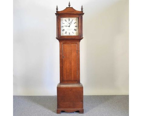 An 18th century oak cased longcase clock, the painted twelve inch dial signed Thos Hubbard Junr, Dorking, with a thirty hour 