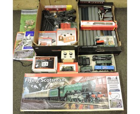 A collection of Hornby 00 gauge model railway, to include Mallard engine, three others, rolling stock, track and accessories