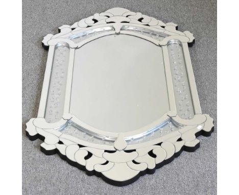 A modern Venetian style wall mirror, with a shaped surround, 142 x 79cm