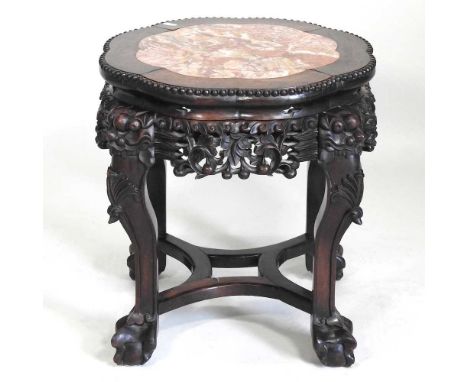 An early 20th century Chinese carved rosewood jardinière stand, with a rouge marble inset top, 44cm wide46cm highOverall look