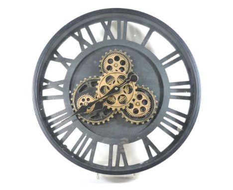 A modern dial clock, with exposed cogs, 48cm diameterOverall condition looks to be ok. It is battery operated and currently r