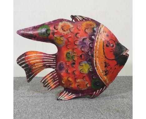 A painted metal tea light holder, in the form of a fish, 60cm long