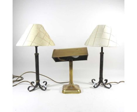 A pair of bronzed table lamps, with cream shades, 45cm high overall, together with a brass desk lamp (3)