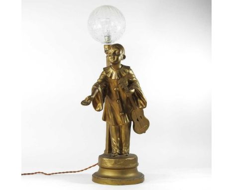 An early 20th century gilt spelter figural table lamp, with a glass shade, 67cm high overall