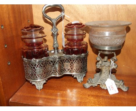 A pair of ruby glass pickle jars and covers in a plated pierced stand, 26cm high overall and a glass bowl, 13cm diameter, 6.5