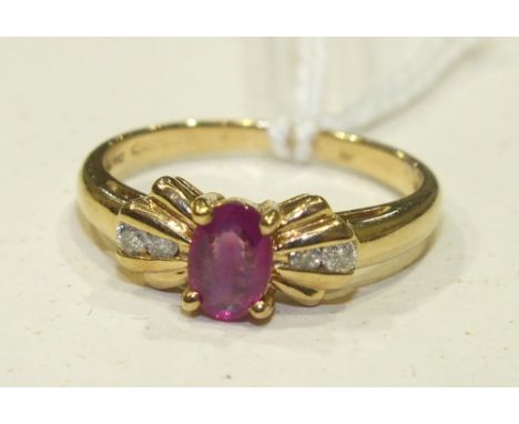 A 9ct gold ring set an oval ruby between diamond set shoulders, size L, 2.4g.