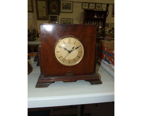 A Bestone stained wood mantel clock/valve radio with Whitehall Hammond Synchronous movement, 29cm high, 32cm wide.