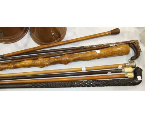 Five silver mounted walking canes, a root-wood stick and three others, (9).